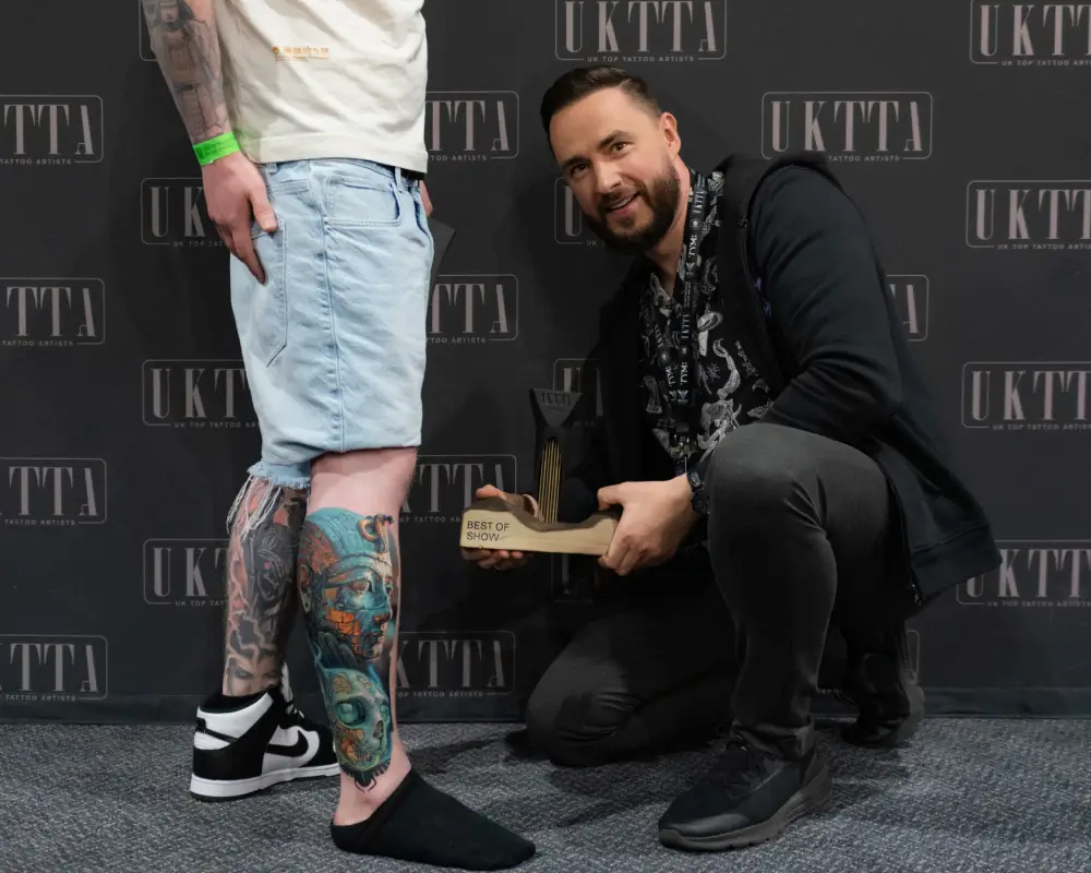 Winner holding trophy